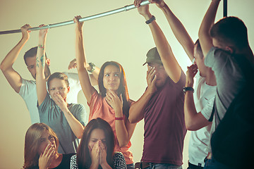 Image showing Sweaty armpits. Sweaty man. Bus. Public transport. The unhappy people near man