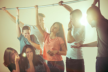 Image showing Sweaty armpits. Sweaty woman. Bus. Public transport. The unhappy people near man