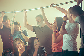 Image showing Sweaty armpits. Sweaty man. Bus. Public transport. The unhappy people near man