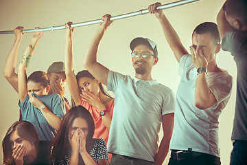 Image showing Sweaty armpits. Sweaty man. Bus. Public transport. The unhappy people near man