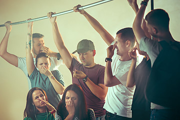 Image showing Sweaty armpits. Sweaty man. Bus. Public transport. The unhappy people near man