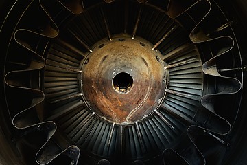 Image showing Rusty old jet engine closeup as background