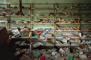 Image showing Abandoned bookstore with shelves full of worn books