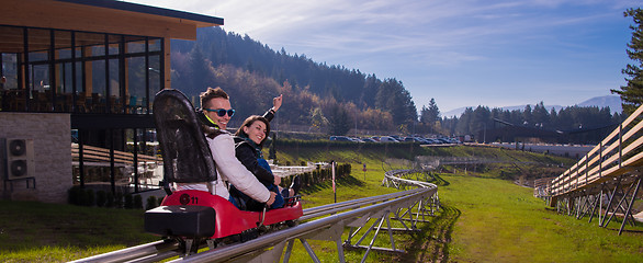 Image showing couple driving on alpine coaster