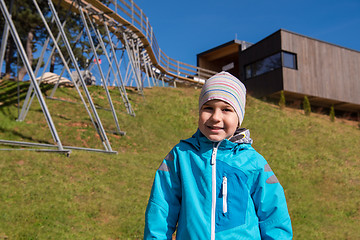 Image showing portrait of a boy under alpine coaster