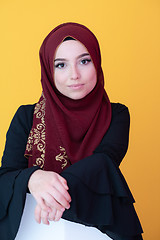 Image showing muslim woman portrait with hijab on yellow background