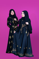 Image showing two hijab muslim woman on pink background