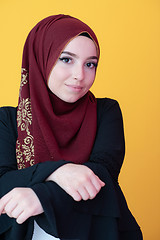 Image showing muslim woman portrait with hijab on yellow background