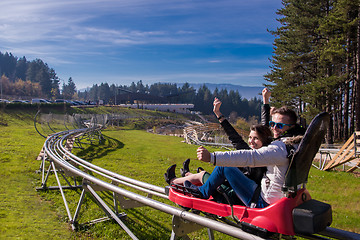 Image showing couple driving on alpine coaster