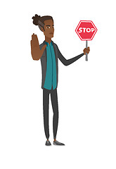 Image showing Young african businessman holding stop road sign.