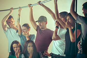 Image showing Sweaty armpits. Sweaty man. Bus. Public transport. The unhappy people near man