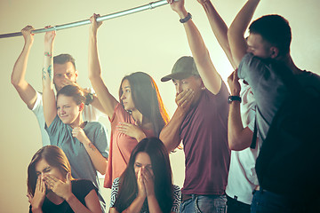 Image showing Sweaty armpits. Sweaty man. Bus. Public transport. The unhappy people near man