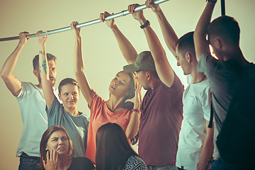 Image showing Sweaty armpits. Sweaty man. Bus. Public transport. The unhappy people near man