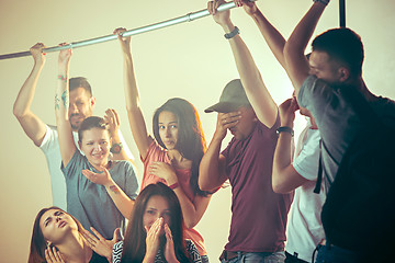 Image showing Sweaty armpits. Sweaty man. Bus. Public transport. The unhappy people near man