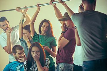 Image showing Sweaty armpits. Sweaty man. Bus. Public transport. The unhappy people near man