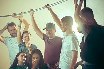 Image showing Sweaty armpits. Sweaty man. Bus. Public transport. The unhappy people near man