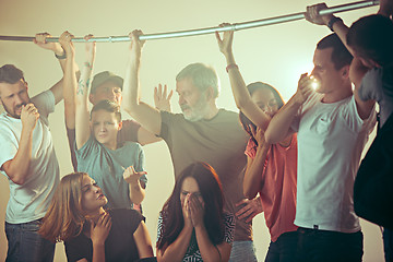 Image showing Sweaty armpits. Sweaty man. Bus. Public transport. The unhappy people near man