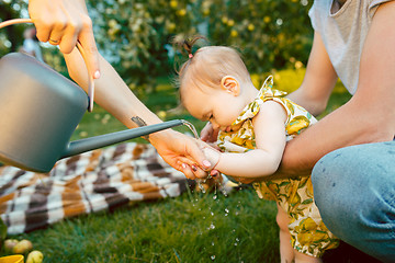 Image showing The watering can for the garden and baby