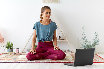 Image showing woman with laptop computer at yoga studio