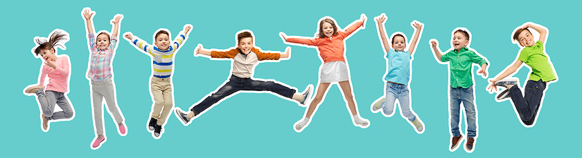 Image showing happy kids jumping in air over blue background