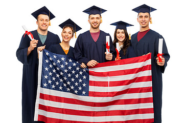 Image showing graduate students with diplomas and american flag