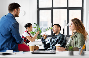 Image showing creative team drinking coffee at office