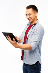 Image showing happy young man with tablet computer