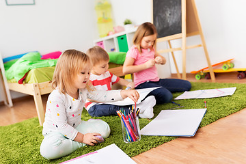 Image showing children drawing and making crafts at home