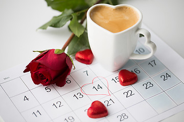 Image showing close up of calendar, hearts, coffee and red rose