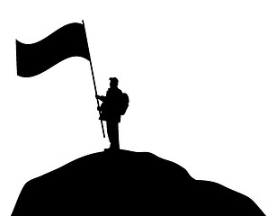 Image showing Man waving large flag on a mountain top