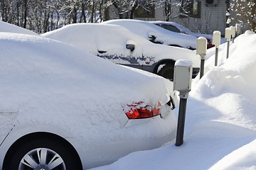 Image showing cars covered in snow in the parking