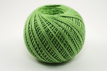 Image showing a skein of green wool on a white 