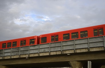 Image showing red subway cars on a overpass