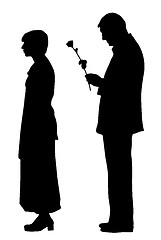 Image showing Man saying sorry and giving a rose to offended woman