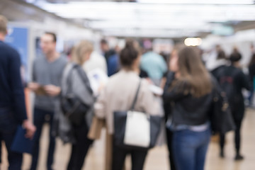 Image showing Blured image of businesspeople socializing and networking during coffee break at conference meeting.