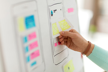 Image showing hand of developer working on ui design at office