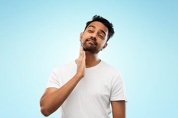 Image showing indian man touching his beard