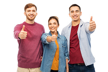 Image showing group of smiling friends showing thumbs up