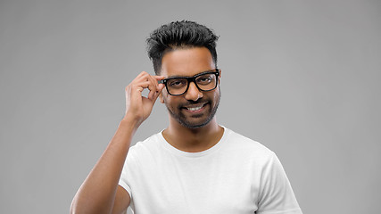 Image showing happy indian man in eyeglasses or student