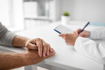 Image showing close up of senior man and doctor at hospital