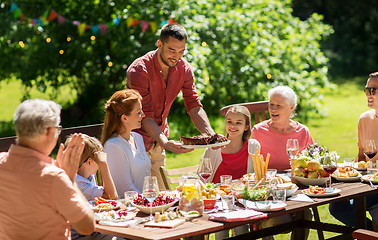 Image showing happy family having dinner or summer garden party