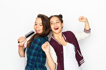 Image showing teenage girls singing to hairbrush and having fun