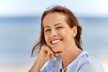 Image showing portrait of happy smiling woman on summer beach