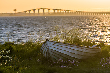 Image showing The swedish Oland Bridge with an old rowing boat in the front