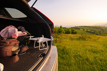 Image showing drone ready for fly in suv trunk l