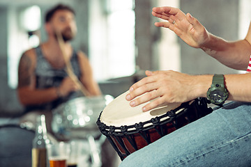 Image showing Repetition of rock music band. drummer behind the drum set.