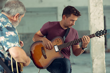 Image showing Repetition of rock music band. Electric guitar players