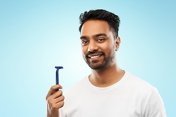 Image showing indian man shaving beard with razor blade