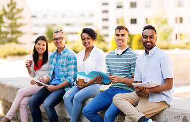 Image showing students with notebook and takeaway drinks