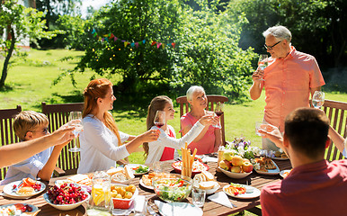 Image showing family gathering at summer garden and celebration